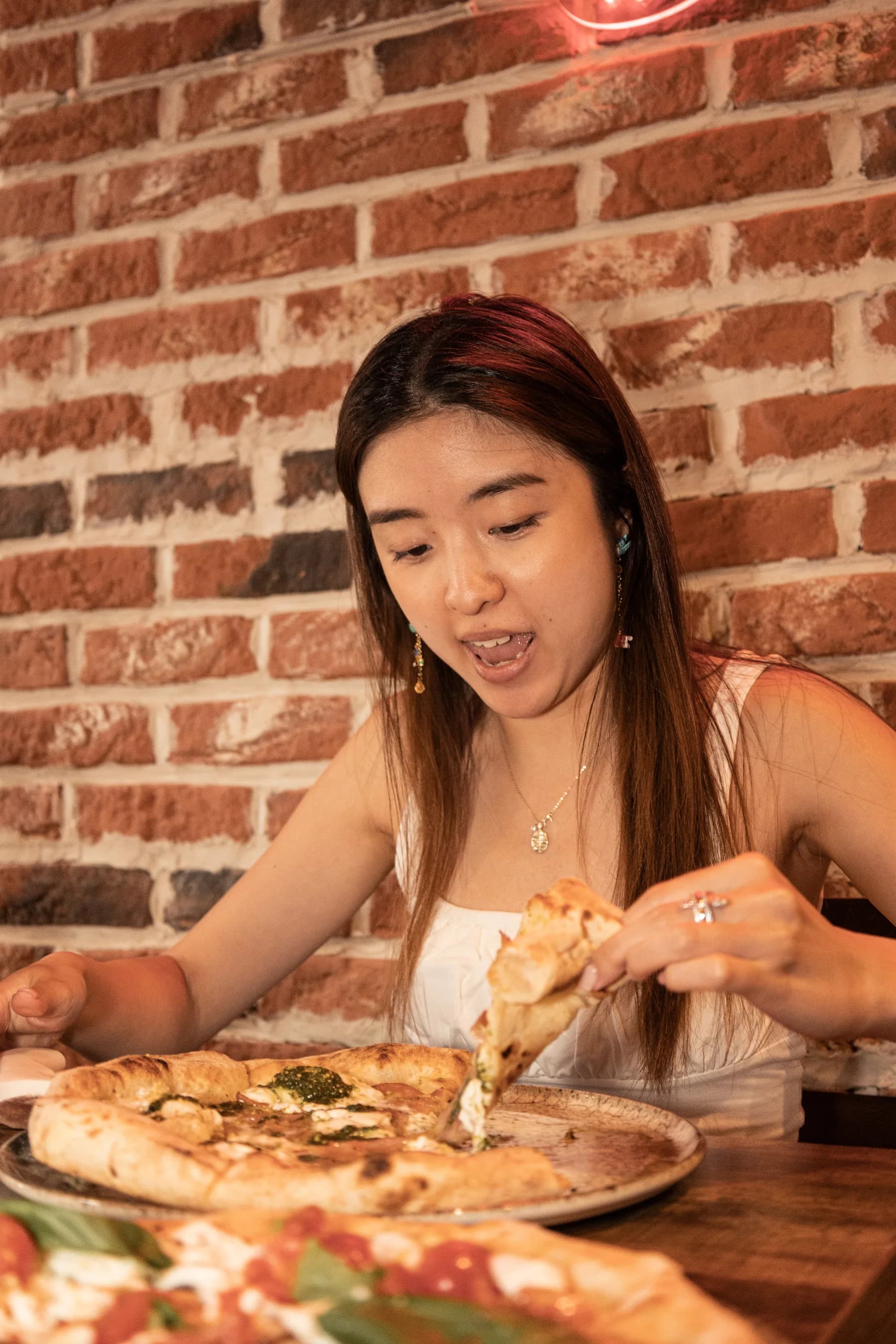 Cheese pull on a fresh Neapolitan pizza
